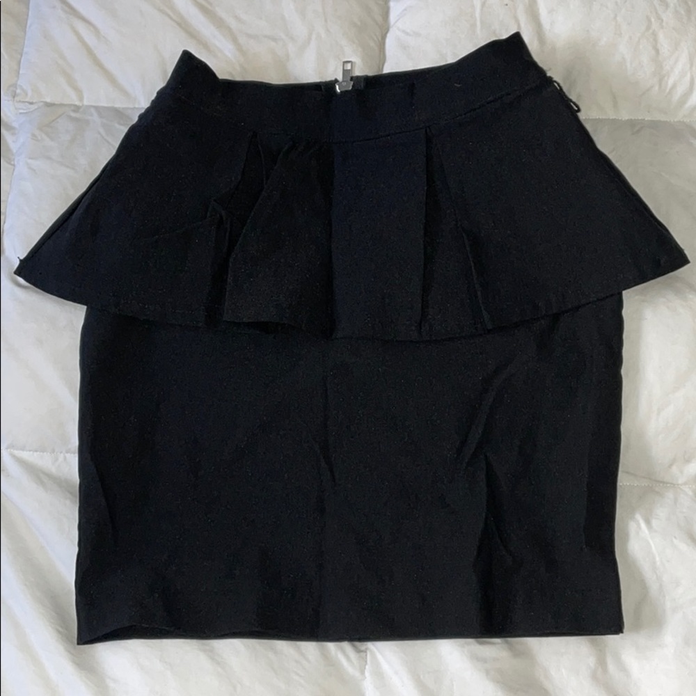Pleated peplum mini skirt